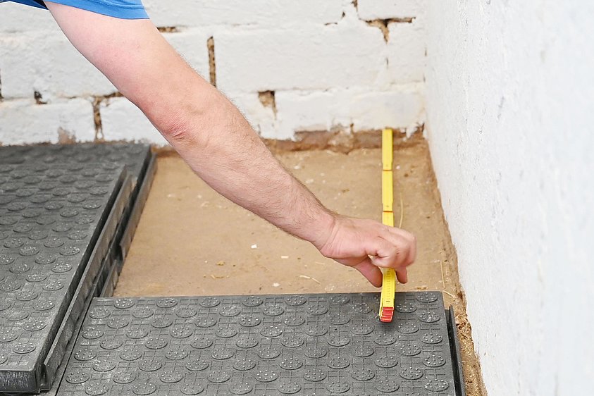 Measure and fit stable mats.